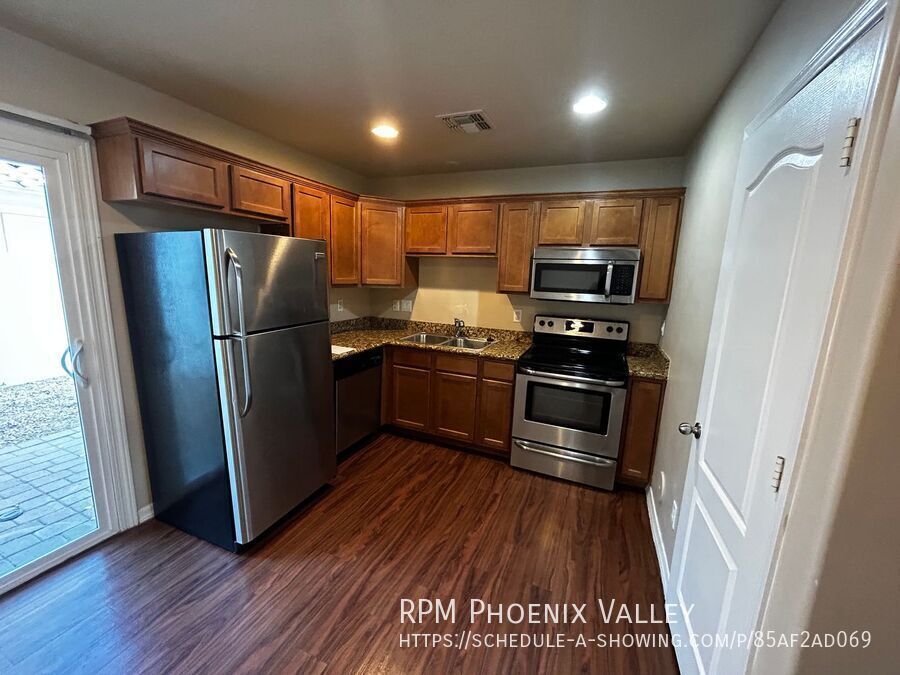Inviting Townhome with Wood Plank Floors & Private Outdoor Space! Available for showings and move in 8/19/2026. property image