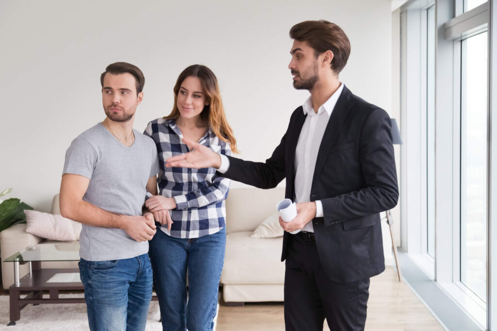 Landlord explains procedures for emergency maintenance to tenant couple in Chandler, AZ